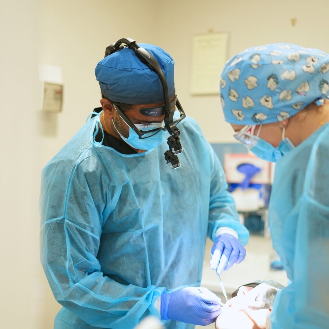 The dental team performing oral surgery in an accredited surgery room at Australind Dental Centre